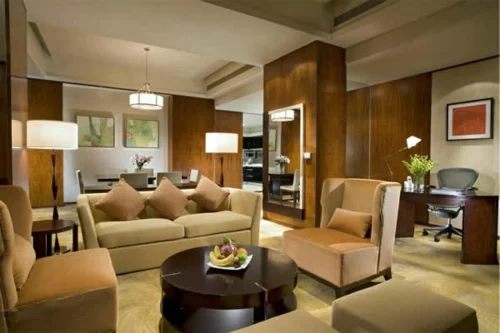 wohnlich warm atmosphäre wohnzimmer sofa sessel kissne kaffeetisch rund