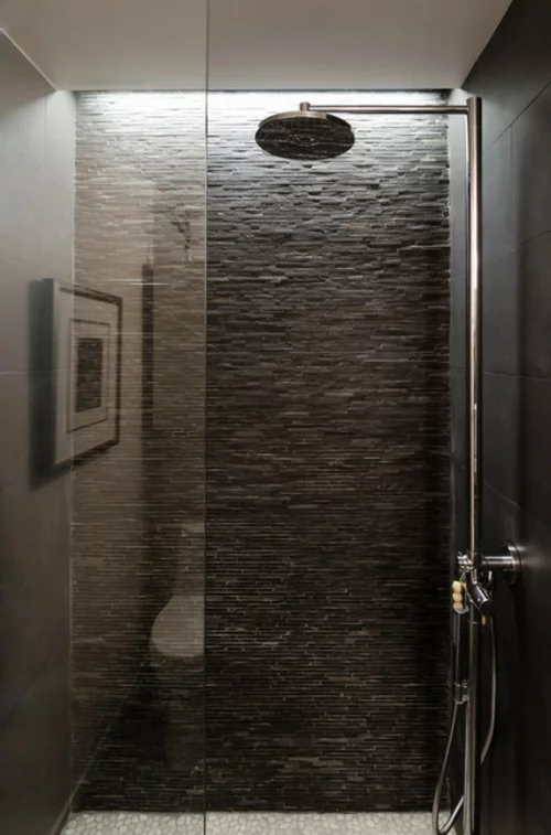 fliesen aus naturstein in grau verglaste duschkabine
