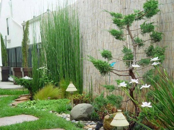 landschafts und gartenbau garten zaun bambus steine