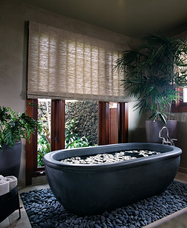 moderne badezimmer schwarze badewanne freistehend kieselsteine rattan