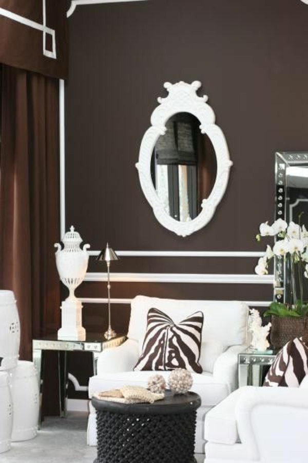 modernes wohnzimmer design wandfarbe brauntöne spiegel sessel 