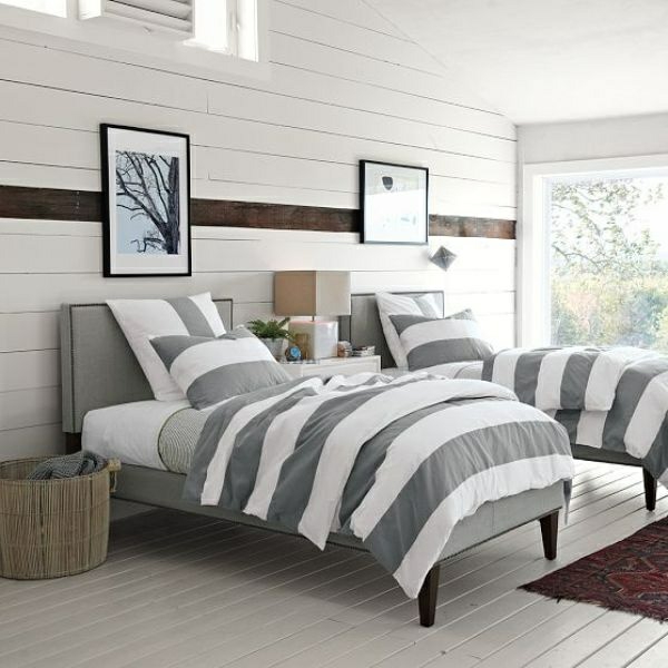 schlafzimmer ideen bettwäsche streifenmuster grau weiß wandpaneele weiß
