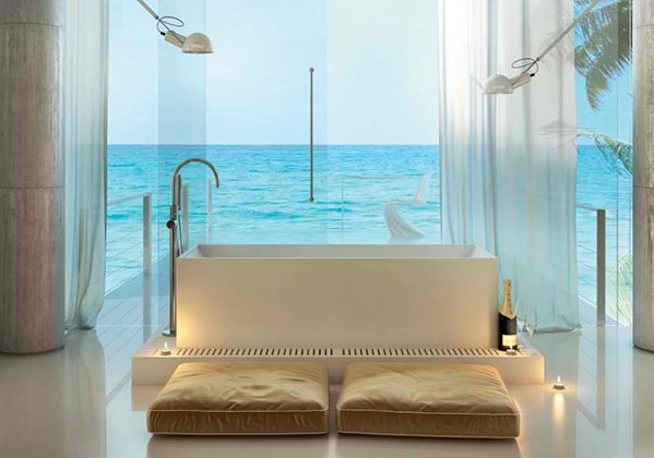 freistehende badewanne modernes badezimmer bodenkissen glaswände meerblick moma design