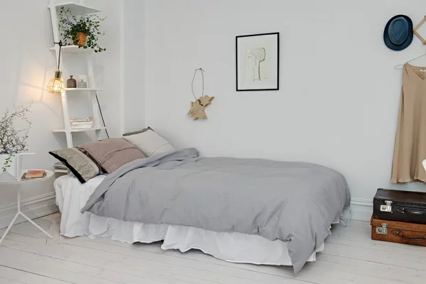 schlafzimmer ideen skandinavischer stil bett wanddekoration zimmerpflanzen