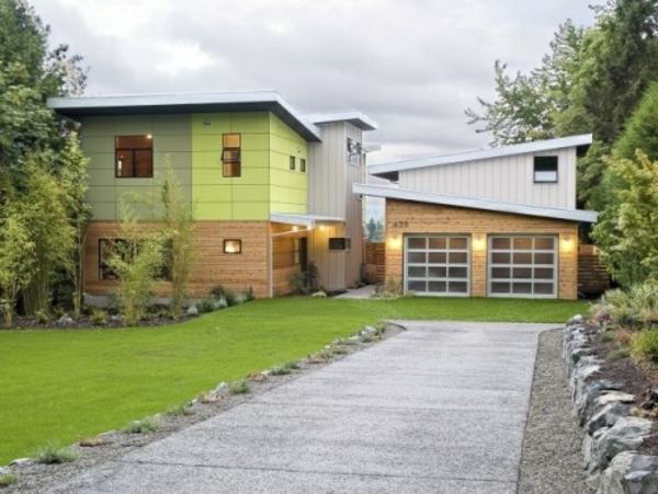 Fassadengestaltung-Einfamilienhaus-vorgarten-gestalten-mit einfahrt-garage-fassaden-farbe-grün