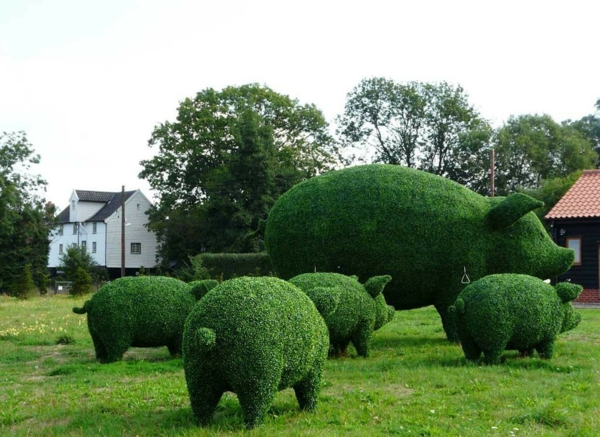 gartenskulpturen grüne schweine