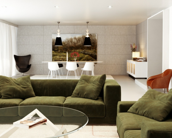 wohnzimmer einrichten runder gläserner tisch grünes sofa