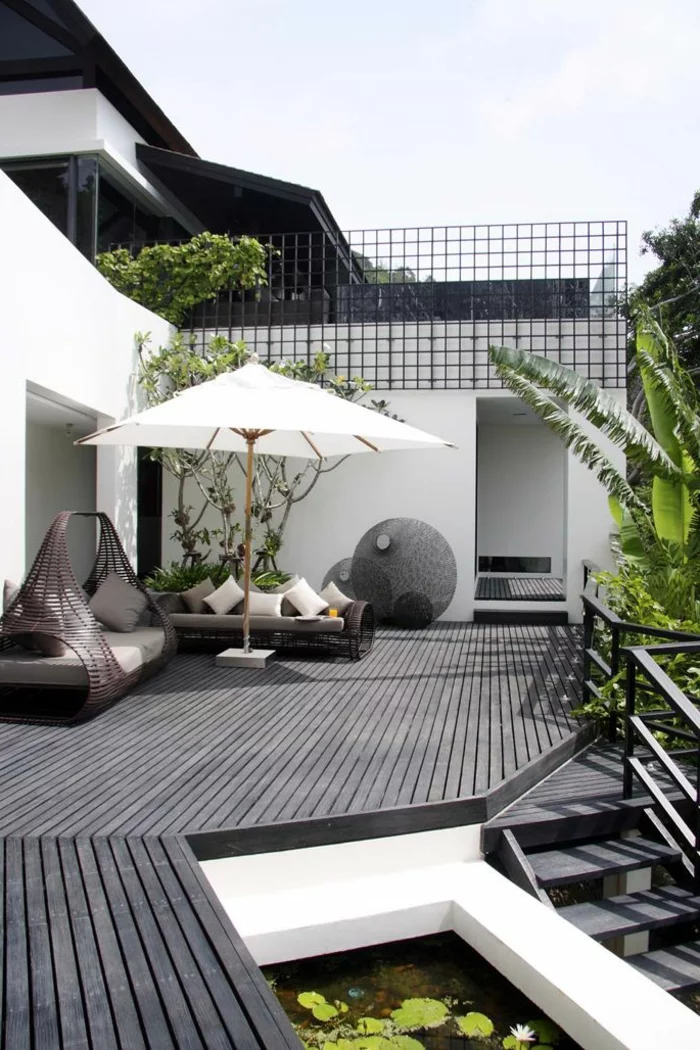 moderne terrassengestaltung elegant ausgefallene außenmöbel sonnenschirm