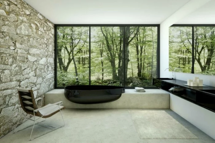 modernes badezimmer badewanne schwarz oval steinwand