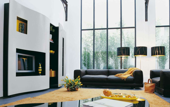 wohnzimmergestaltung schwarze möbel gelbe akzente kamin gelber teppich