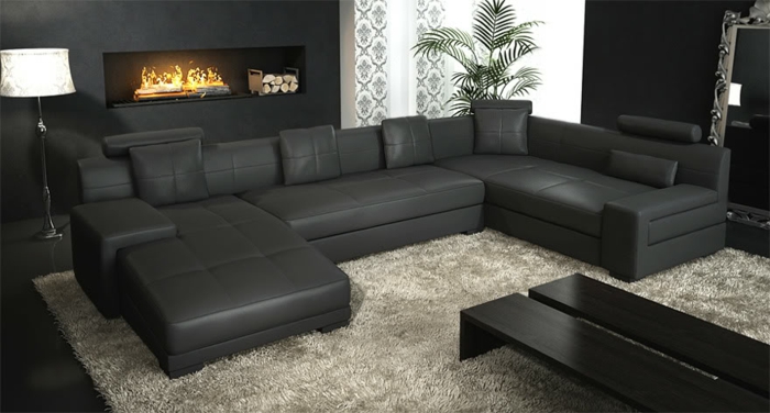 ausgefallene sofas schwarzes ledersofa beiger teppich kamin