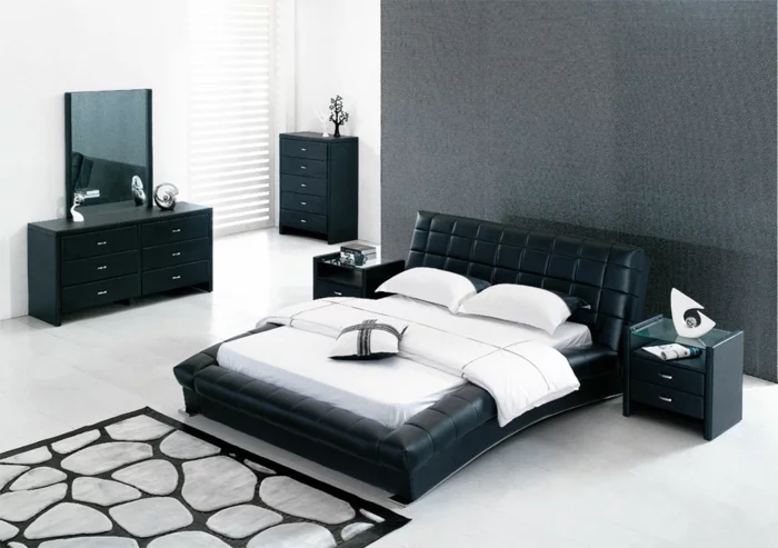 design betten schwarz leder komfort stil cooler teppich weiße wandfarbe schwarze kommode