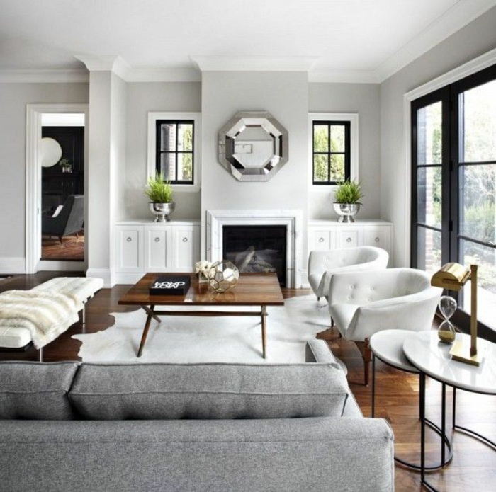 kamin design wohnzimmer einrichten weißer fellteppich graues sofa