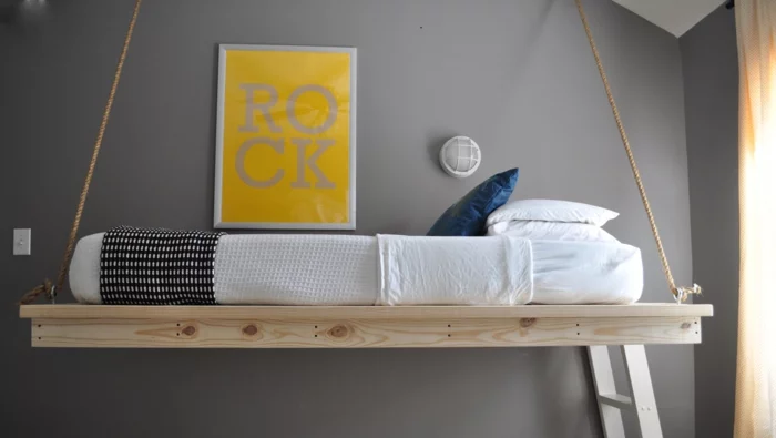 schlafzimmer design hängendes bett graue wandfarbe