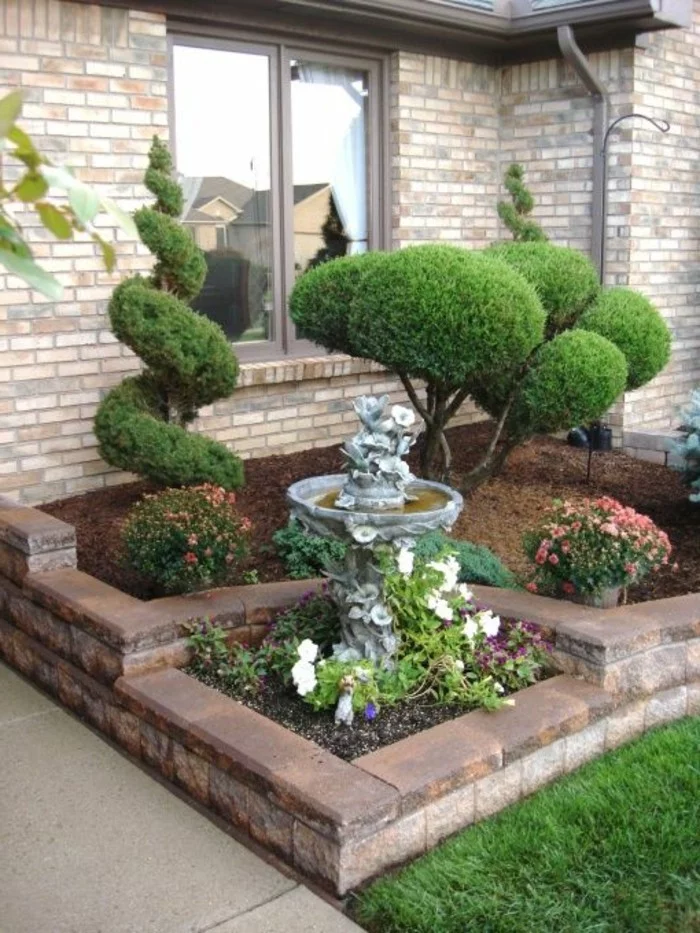 vorgartengestaltung ausgefallene dekoideen mit schönen pflanzen und gartenbrunnen