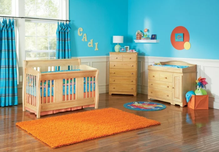 babybetten design babyzimmer oranger teppich blaue wandfarbe