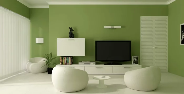 kleines wohnzimmer einrichten wandfarbe grün weiße runde sessel wandregale
