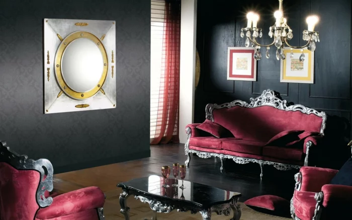 schwarze wandfarbe wohnzimmer einrichten luxuriöse rote sofas eleganter couchtisch