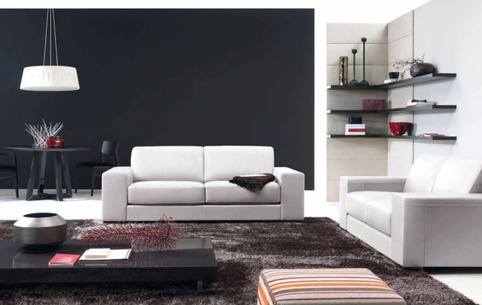 wandgestaltung ideen wohnzimmer scvhwarze akzentwand essecke weiße sofas eckregale