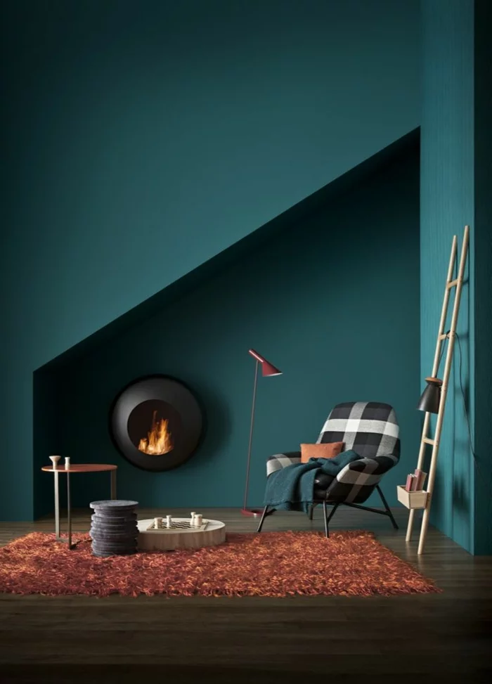 wanfarben ideen dunkelgrüne wandfarbe oranger teppich moderner kamin wohnbereich