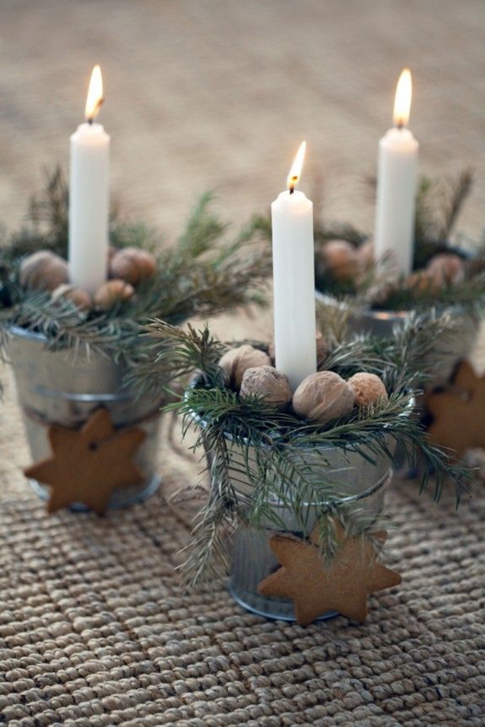 weihnachtliche Tischdeko Ideen Kerzen Wallnüsse Zweige natürliche Dekoration