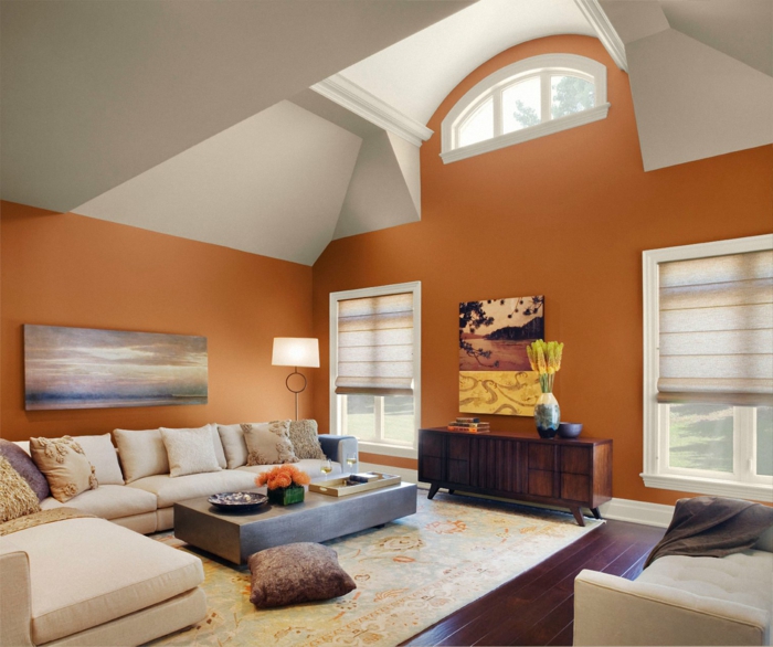 wohnzimmer ideen orange wände heller teppich ecksofa retro kommode