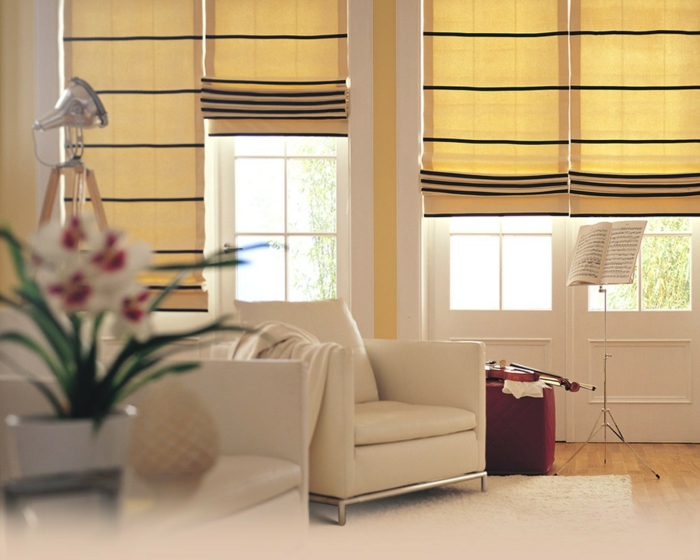 gardinenstoffe vorhangstoffe vorhänge pastell gelb modernes design wohnzimmer ledersessel