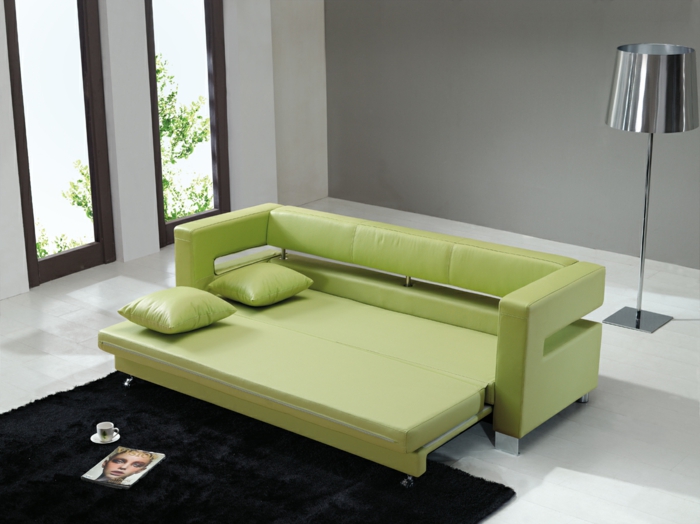schlafsofa design grün stilvoll wohnzimmer schwarzer teppich
