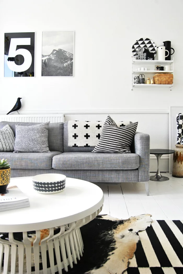 wandfarbe weiß wohnzimmer graues sofa runder couchtisch