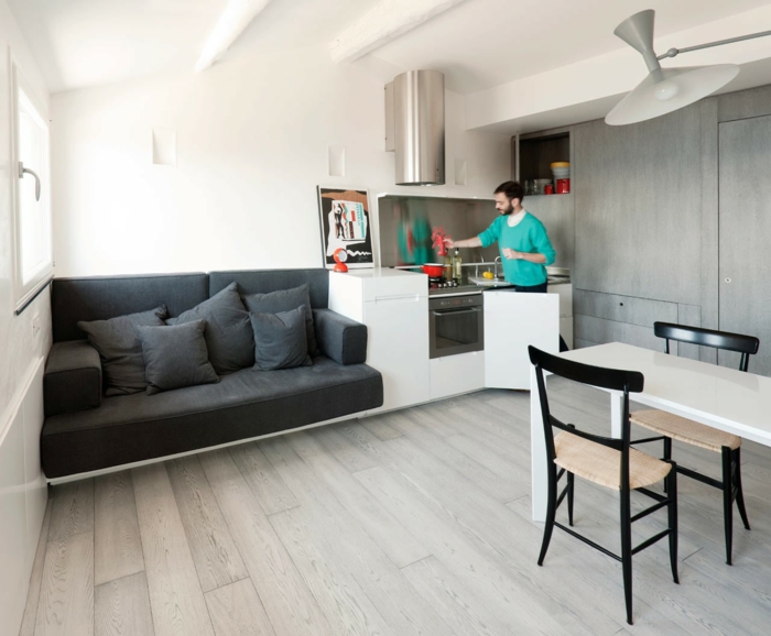 einzimmerwohnung graues sofa esstisch küche raumgestaltung