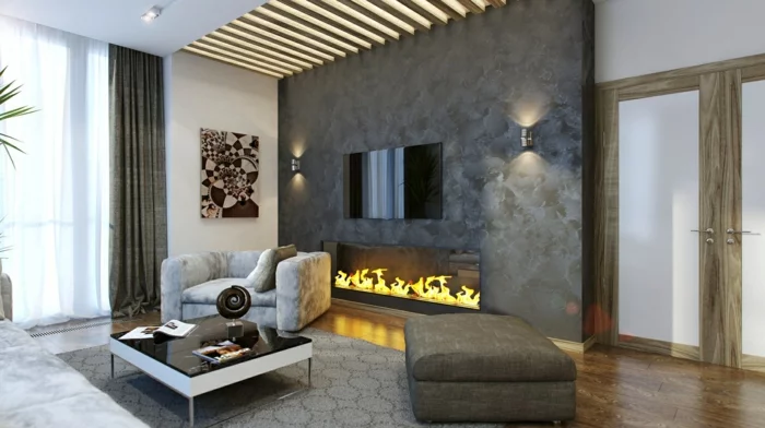 Wohnzimmer mit Steinwand in Natursteinoptik und moderner Feuerstelle