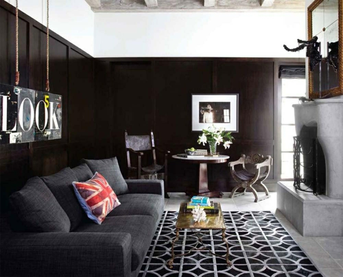 wohnzimmerteppich luxuriös dunkelgraues sofa schwarze wände