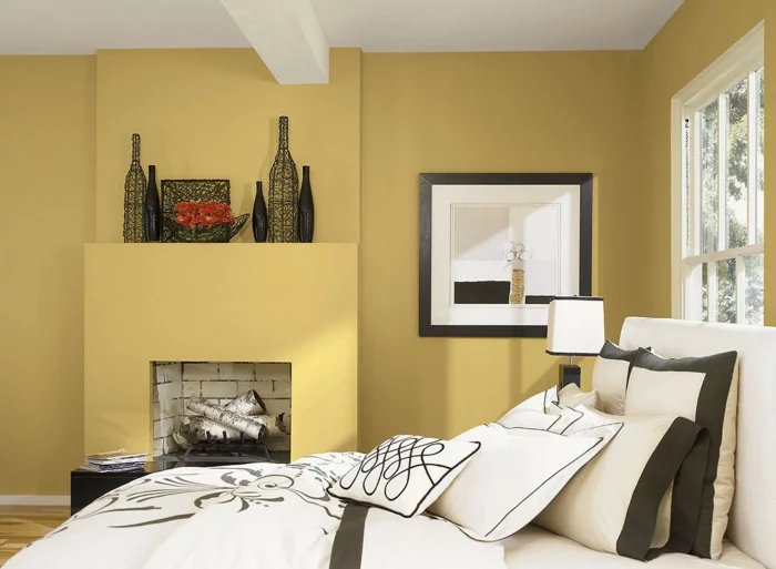 einrichtungsideen schlafzimmer gelbe wandfarbe kamin