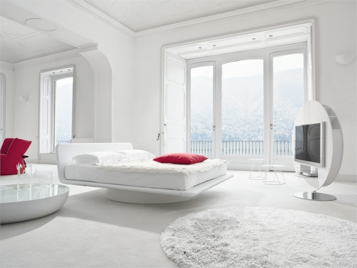 schlafzimmer weiß runde teppiche rote akzente
