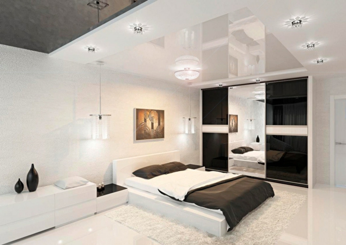 schlafzimmer weiß schwarze spiegeloberflächen teppich