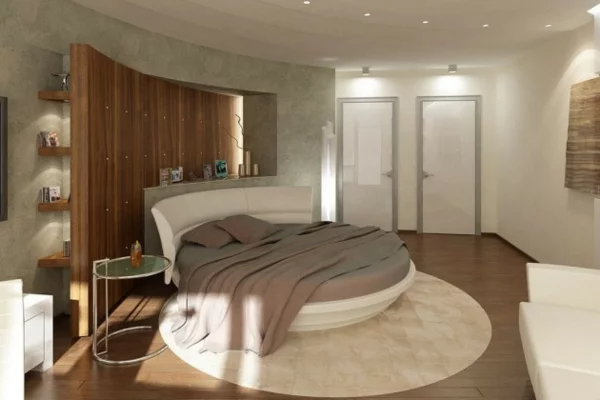 schlafzimmer einrichten rundes doppelbett runder teppich wandregale wandverkleidung