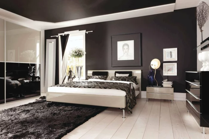 Schlafzimmer in Schwarz mit einem hellen Boden und schwarzer Zimmerdecke