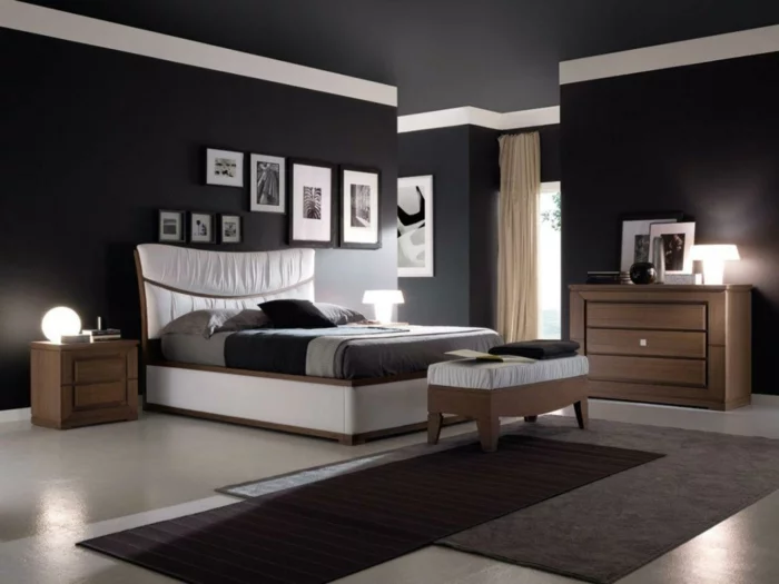 Schlafzimmer in Schwarz mit Teppich und Teppichläufer und Wandbildern