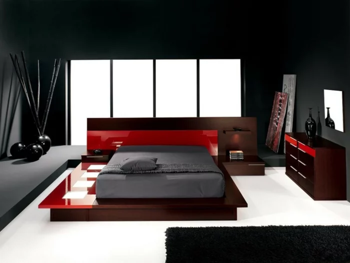 Schlafzimmer in Schwarz mit weißem Boden und roten Spiegeloberflächen 