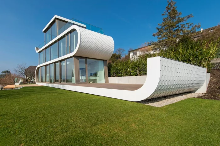 außergewöhnliche ferienhäuser schweiz wellen moderne architektur organische formen
