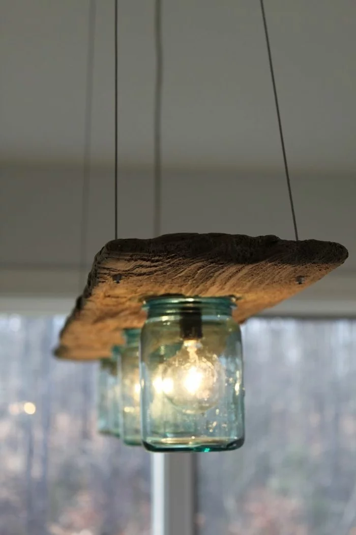 DIY Ideen mit Einmachgläsern - rustikaler Leuchter mit Einmachgläsern und Holzbrett