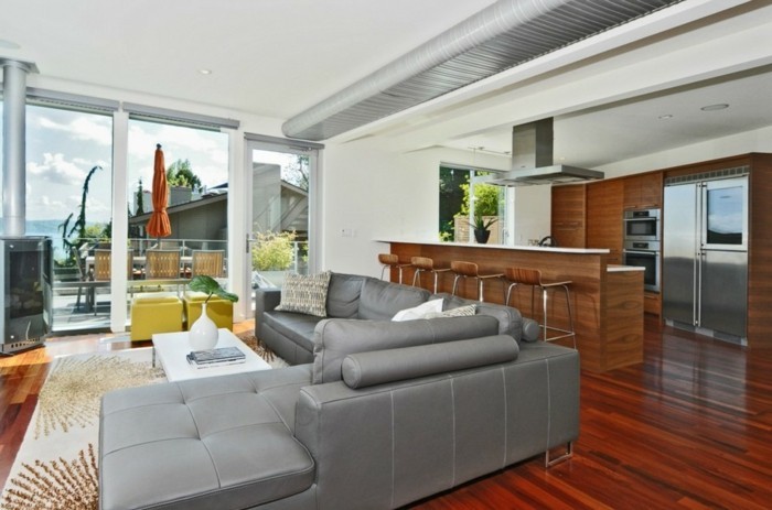 schönes wohnzimmer graues sofa offener wohnplan eleganter teppich