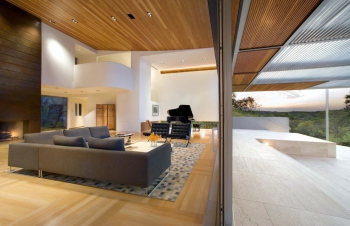 wohnideen wohnzimmer geometrischer teppich geräumig moderne beleuchtung