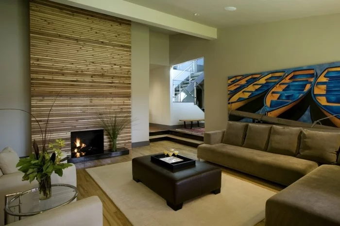 wohnideen wohnzimmer kamin beiger teppich schickes sofa akzentwand