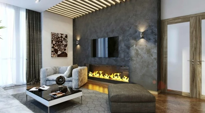 graues Wohnzimmer gestalten mit Feuerstelle und moderner Decke