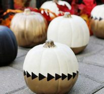 Herbst Dekoration zu Halloween mit bemalten Kürbissen
