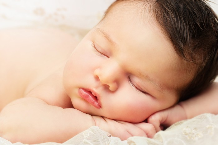 Horizontal color image of newborn baby