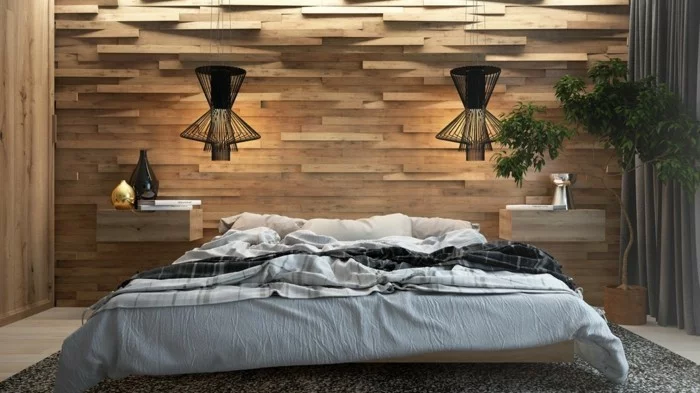 wohnideen schlafzimmer moderner schlafbereich mit holzpaneelen und schwarzen hängelampen