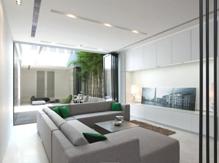led lichtleiste wohnzimmer beleuchten ideen grüne dekokissen