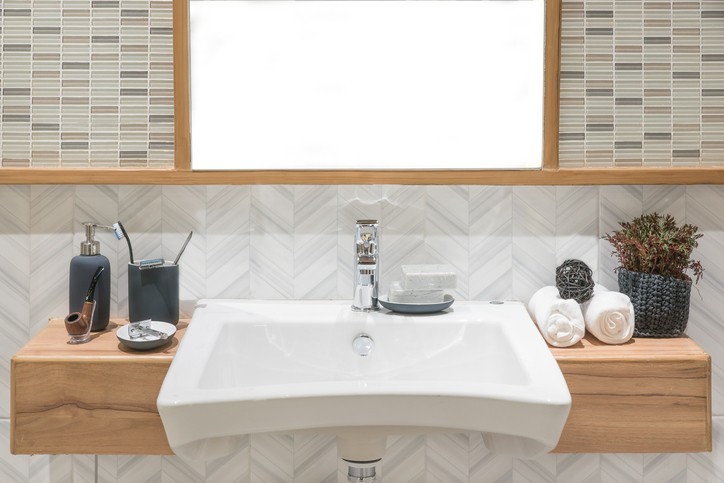 Washbasin with towel and decoration in bathroom